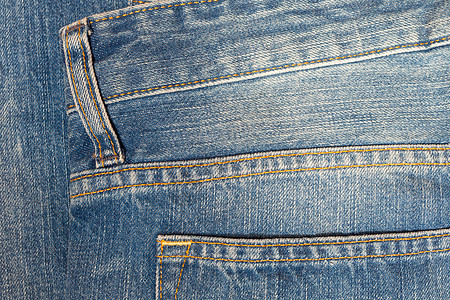 背景牛仔布质地或牛仔裤背面裤子宏观纤维织物材料纺织品靛青接缝棉布边界图片