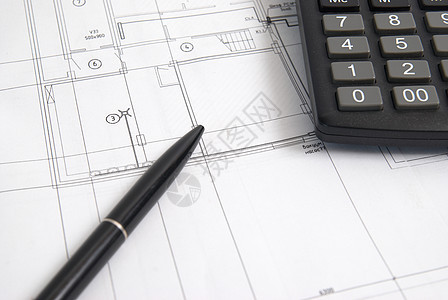 计算和笔在绘图上工作房间建筑建筑学工程草图建筑师设计师商业建造图片