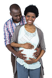 男人触摸孕妇胃部孕妇装亲子女性男性微笑怀孕感情快乐服装拥抱图片