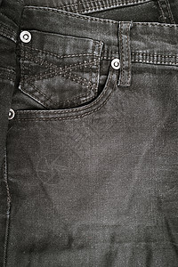 黑色牛仔牛仔裤裤袋的特写细节织物口袋接缝工作服宏观棉布材料帆布服装荒野图片
