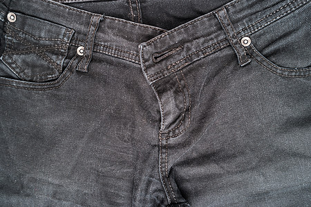 黑色牛仔牛仔裤裤袋的特写细节材料服装棉布荒野纤维工作服织物纺织品靛青口袋图片