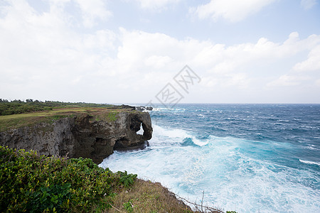 冲绳的曼扎莫角海景土地石头天空海岸太阳珊瑚海浪波浪风暴图片