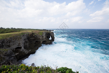 冲绳的曼萨角晴天岩石地质学日落海岸天空太阳半岛悬崖蓝色图片