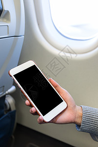 在飞机上拥有数字移动电话的妇女 妇女图片