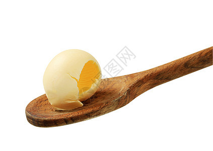 木勺上的黄油卷子奶制品卷曲用具勺子厨房食物白色食品图片