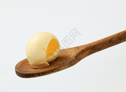 木勺上的黄油卷子奶制品卷曲勺子食物用具厨房食品图片