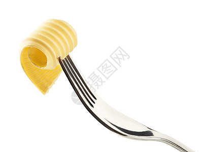 叉子上的黄油卷曲盘食物奶制品卷曲食品金属黄油图片