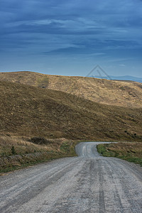 山路蓝色阳光岩石天空太阳草地小路日落环境森林图片