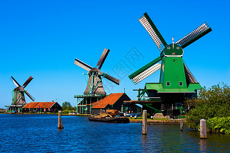 荷兰的磨坊照片铣削文化天空溪流风车农村供电地标蓝色图片