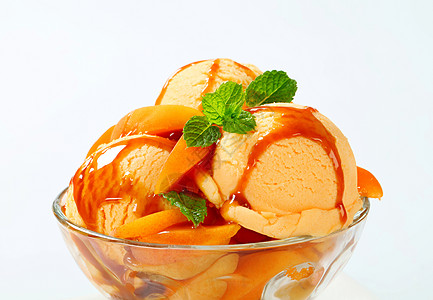 冰霜圣代焦糖奶糖轿跑车玻璃配料勺子橙子甜点食物水果图片