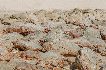 岩石背景棕色宏观海岸线石头墙纸材料场景支撑花岗岩背景图片