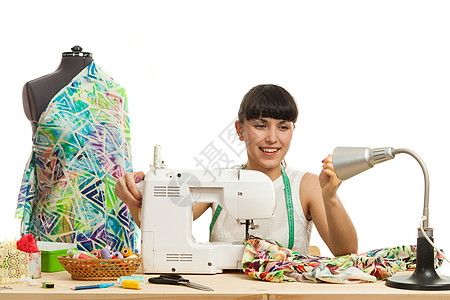 缝合器将产品缝在桌子上女士磁带接缝白色测量材料商业艺术线程创造力图片