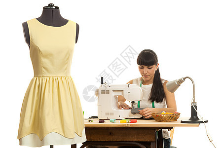 缝合器将产品缝在桌子上缝纫机械测量技术服装白色创造力线程磁带纺织品图片