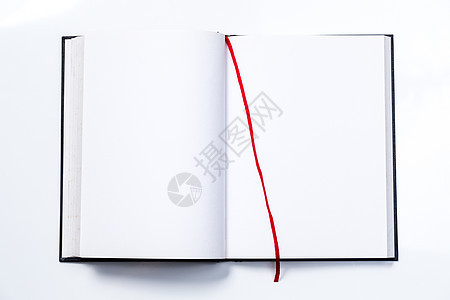 带红丝带的空白开放书打印图书馆教育红色白色床单日记背景图片