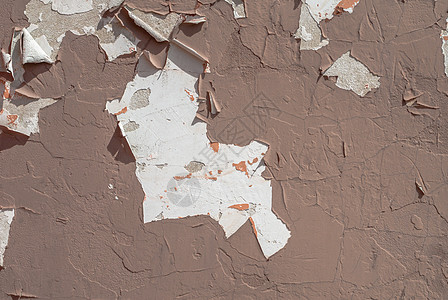 旧石膏墙 风景风格 混凝土表面 大背景或纹理上的薯片涂料象牙艺术风化建筑棕褐色合金珊瑚建筑学墙纸水泥图片