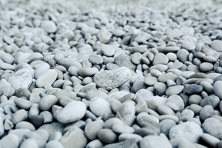 自然抛光的白岩石块背景治疗鹅卵石温泉墙纸宏观花园海滩石头矿物卵石图片