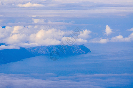 拉戈梅拉岛在西班牙特内里费云后风景蓝色海岸沙漠岩石天空火山戏剧性旅行图片