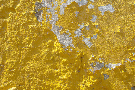 旧石膏墙 风景风格 混凝土表面 大背景或纹理上的薯片涂料合金黄色灰色建筑白色墙纸风化水泥棕褐色石头图片