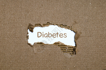 糖尿病这个词出现在撕破的纸后面治疗诊断葡萄糖饮食重量胰腺医疗保险症状风险肥胖图片