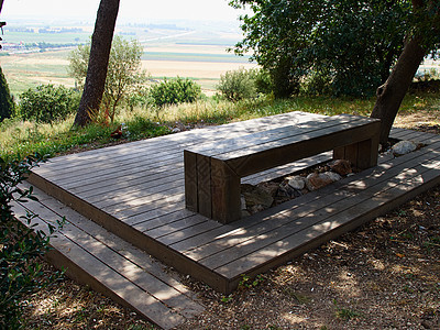 公园中用木制成的座椅硬木家具花园胡同民众阳光休息孤独木头长椅图片