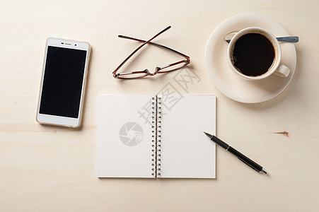 小笔记本和咖啡杯细胞触摸屏记录备忘录会议办公室咖啡杯子电话日记图片