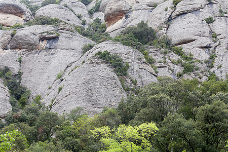 西班牙圣玛丽亚德蒙特塞拉特修道院附近的蒙特塞拉特山丘石头地标岩石山脉爬坡图片