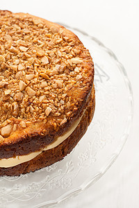 蛋糕加奶油 洒满坚果和蜂蜜的奶油糕点烘烤温度面包面团糖果产品生日托盘美食图片