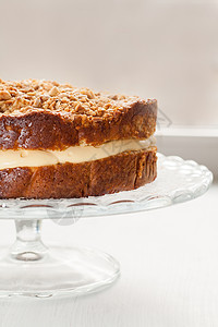 蛋糕加奶油 洒满坚果和蜂蜜的奶油产品面团托盘团体温度烘烤糕点甜点糖果宏观图片