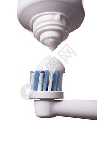 紧贴电动牙刷和白纸糊口服器具广告牙齿牙膏卫生预防营销管子用品图片