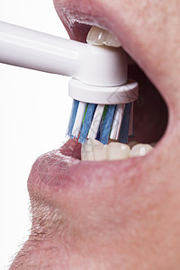 紧贴电动牙刷和白纸糊用品家庭塑料刷子清洁度牙膏口服衰变牙刷器具图片