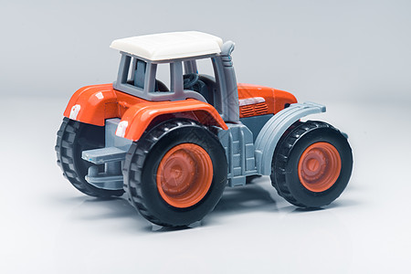儿童塑料玩具拖拉机农民农田景深农机拖带农具力矩收成车辆磁盘图片