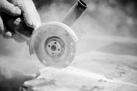 干磨工人切碎石块建设者工具花岗岩锤子建造车轮力量岩石灰尘瓦工图片