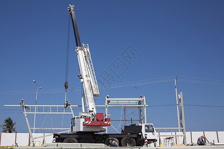 起重机和金属结构卡车钢结构建造建设者工人动员劳动贸易工作劳动者图片