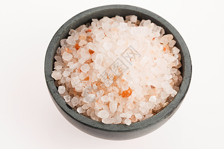 喜马拉雅粉红盐橙子食物白色岩石矿物宏观调味品水晶背景图片