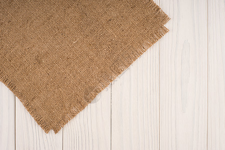 木桌背景上的粗麻布纹理解雇木板帆布织物航海材料麻布墙纸黄麻框架图片