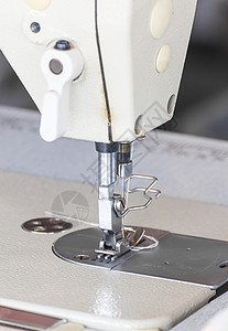 特写工业缝缝纫机工艺针脚手工业裁缝剪裁服装维修棉布制造业机器图片