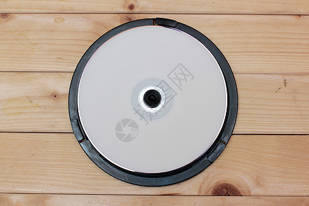 木木背景回转的 CD 驱动器立体声圆圈技术贮存盘子工作室备份记录磁带历史图片
