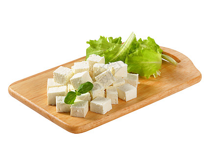 Feta 奶酪砧板盘子小吃奶制品食物美食立方体白色图片