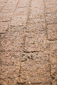 公园中红土人行走道的模式展示褐色地面建造人行道花岗岩艺术石头途径岩石图片