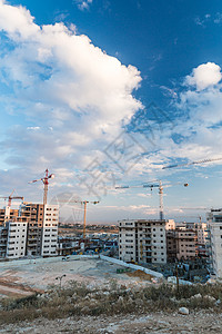 城市的建设生长蓝色金属起重机商业房子技术工程施工住房图片