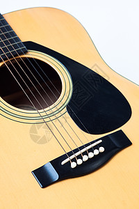 白色背景的音乐吉他民间材料指板乐器烦恼木头水平细绳海报摄影图片