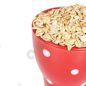 红色杯子 白色背景的燕麦片堆积谷物午餐麦片小麦薄片早餐混合物收成粮食种子图片