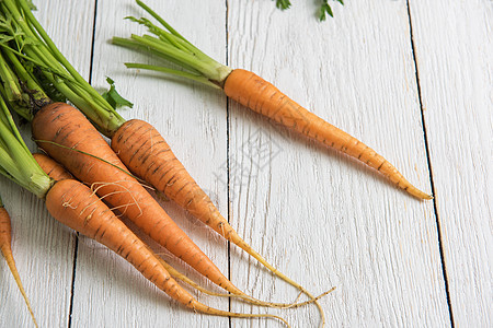 新鲜生长的胡萝卜维生素收成乡村蔬菜橙子健康饮食食物小吃营养市场图片