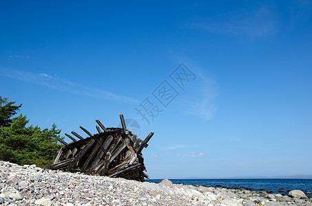 旧木船沉船石头残骸蓝色海岸海景木头支撑破坏风暴血管图片
