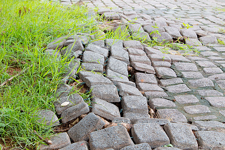 人行道上的砖虫或砌砖虫拍摄角度 i小路岩石材料城市水泥建筑学橙子花园季节地面图片