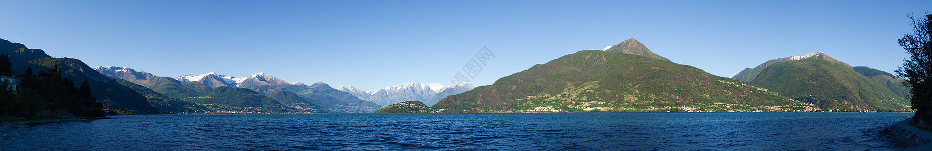 傍晚阳光下从海滩到科莫湖的全景反射波纹国家季节海岸爬坡天空房子支撑石头图片