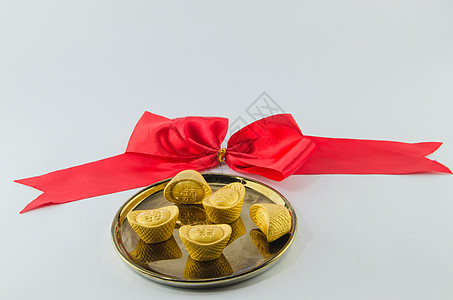 黄金金色的金盘白本底语言配偶财务新年财富双喜盘子婚姻蝴蝶结货币图片