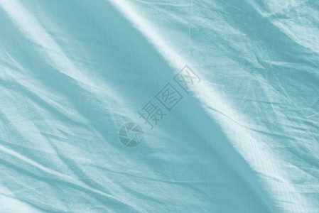 作为背景的皱巴巴的床单纹理材料海浪帆布被单涟漪织物亚麻折痕寝具棉布图片