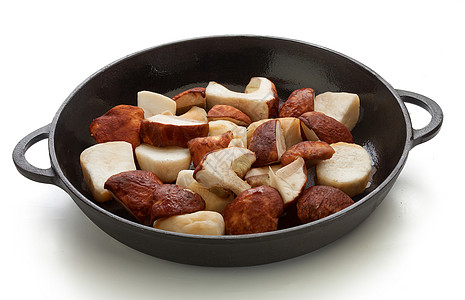 黑铁锅里的白蘑菇盘子黑色烹饪平底锅收成隔断油炸蔬菜食物图片