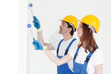 工人油漆墙建筑团队女士安全帽滚筒男人工作头盔工匠画家图片